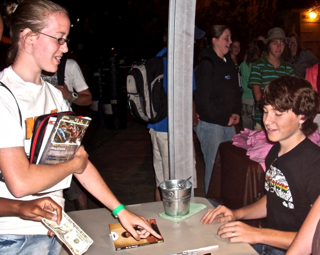 Zach is busy signing copies of Be the Change to encourage students like our Emmah.  July - '07